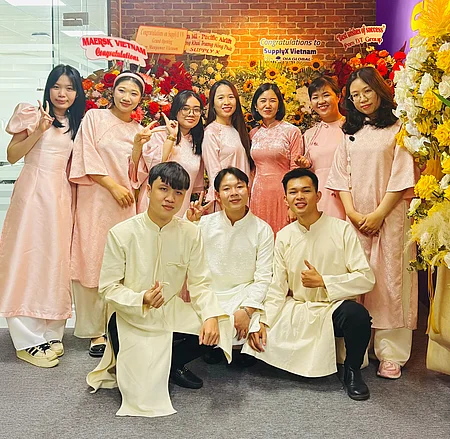 Vietnamese people in traditional dress celebrating SupplyX Office launch
